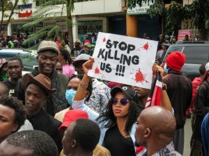 Family members of Boniface Kariuki gather at Kenyatta National Hospital after he was declared brain dead following a police shooting during protests.