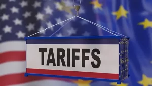 EU and US flags waving side by side, representing ongoing trade negotiations.
