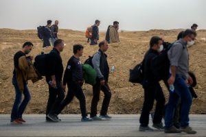 Afghan refugees at a UK airport arriving under a secret resettlement programme after Taliban threats.