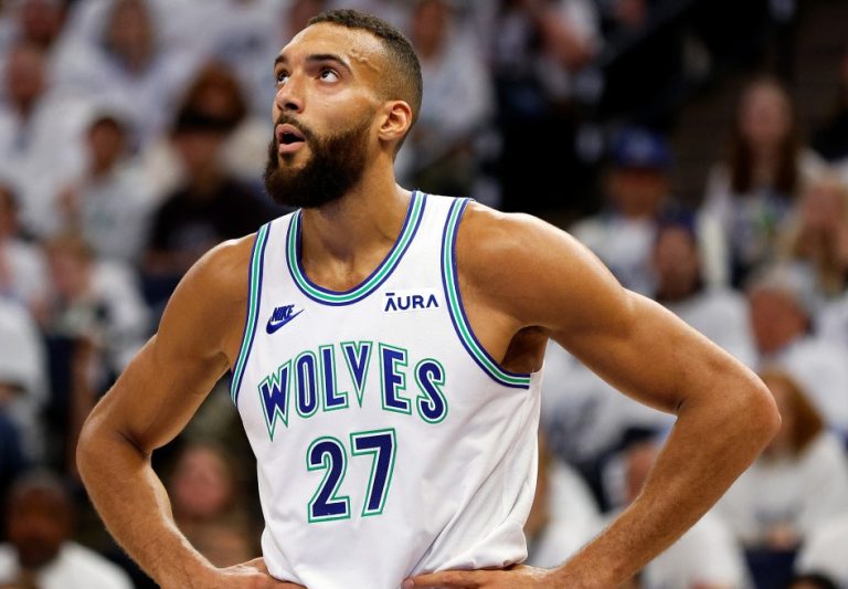 Minnesota Timberwolves center Rudy Gobert almost hit by falling piece of scoreboard during game
