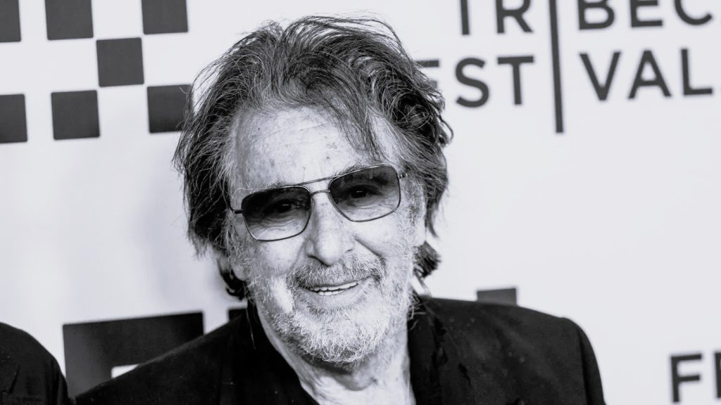 Al Pacino smiling at an event, reflecting on fatherhood and his acting career.