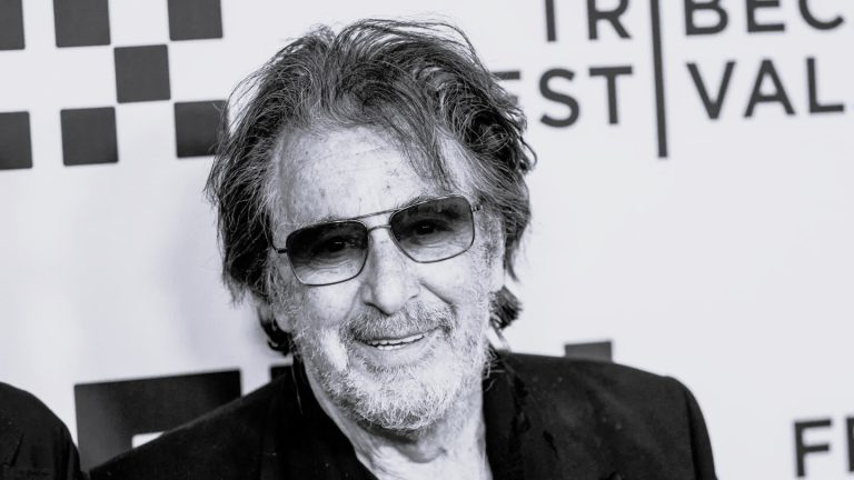 Al Pacino smiling at an event, reflecting on fatherhood and his acting career.