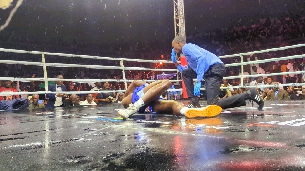 Ahmed Abdula raises his gloves in victory as the crowd celebrates his cruiserweight title win at Bukom Boxing Arena.