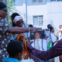 Congolese Catholics hold a banner with the image of Floribèrt Kositi during beatification celebrations in Goma.