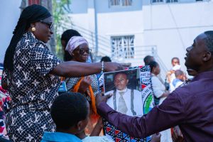 Congolese Catholics hold a banner with the image of Floribèrt Kositi during beatification celebrations in Goma.