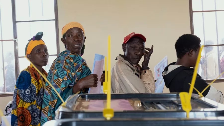 Burundi citizens line up to vote as political tension rises over disputed legislative elections.