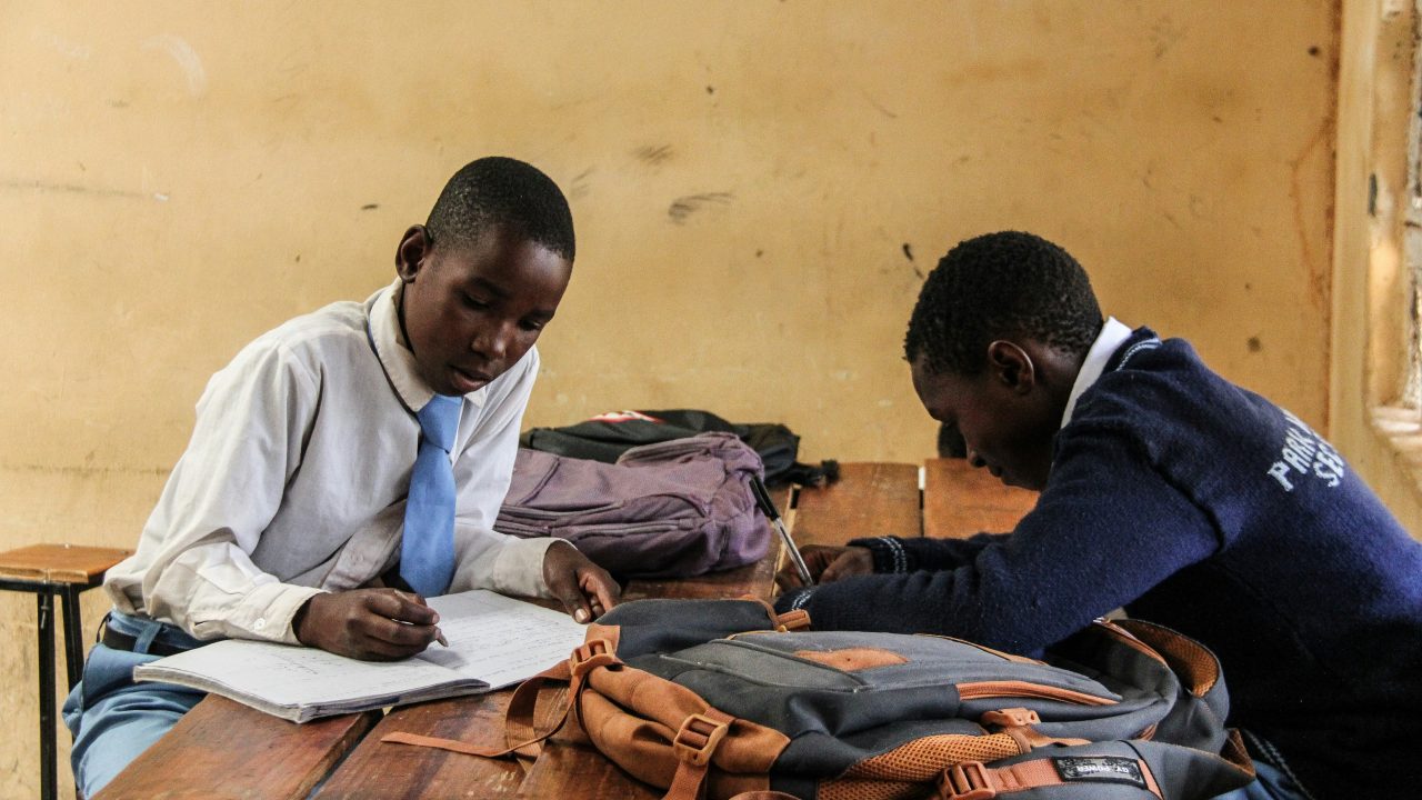 Students fleeing an exam hall in panic, with emergency responders helping the wounded after a tragic stampede in Bangui, Central African Republic.