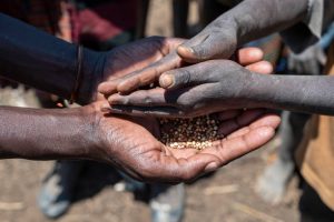 Children in South Sudan gather near humanitarian aid tents amid worsening food crisis in Upper Nile state.