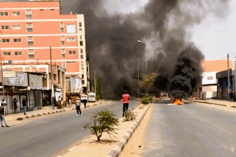 Angolan police in riot gear clash with protesters during fuel price demonstrations in Luanda.