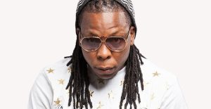 Ghanaian rapper Edem performs his song “Toto” with students and MPs outside Parliament House, sparking cultural debate.