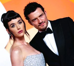 Katy Perry and Orlando Bloom pose together before announcing their split, confirming they’ll focus on raising their daughter.