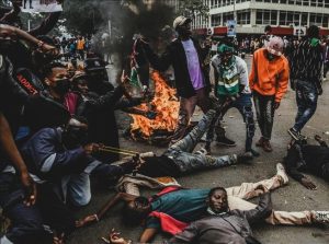Demonstrators block roads and light fires as police respond with tear gas in central Nairobi during Kenya’s Saba Saba protests.