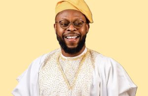 Ghanaian comedian Kalybos smiling in front of a crowd, known for his role in Boys Kasa and his humble connection with fans.