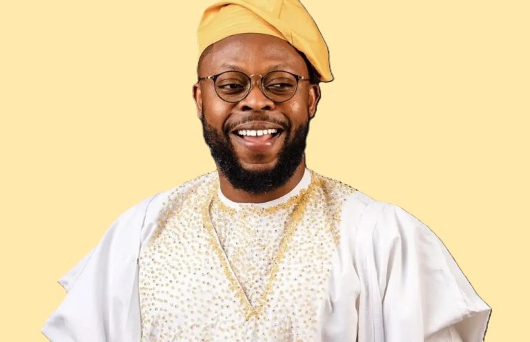 Ghanaian comedian Kalybos smiling in front of a crowd, known for his role in Boys Kasa and his humble connection with fans.