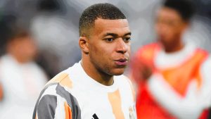 Kylian Mbappé warms up with Real Madrid as tensions with former club PSG cool following the withdrawal of his harassment complaint.