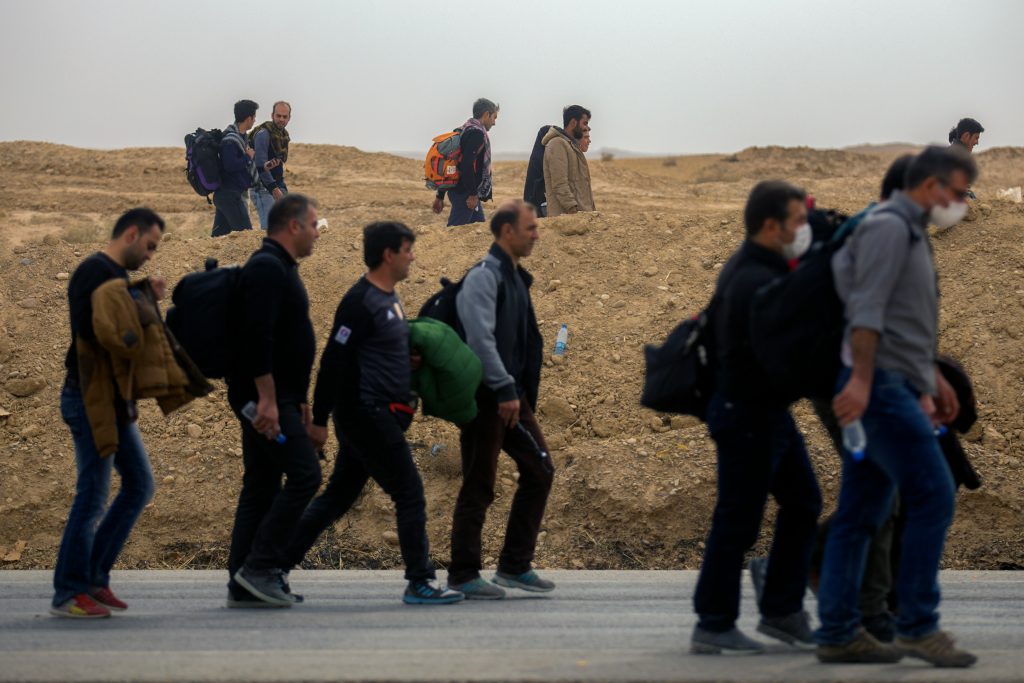 Afghan refugees at a UK airport arriving under a secret resettlement programme after Taliban threats.