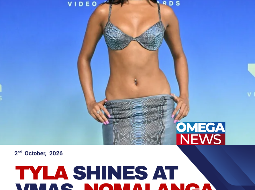 Tyla poses at the 2026 MTV Video Music Awards in a blue snakeskin bra and low-rise skirt.
