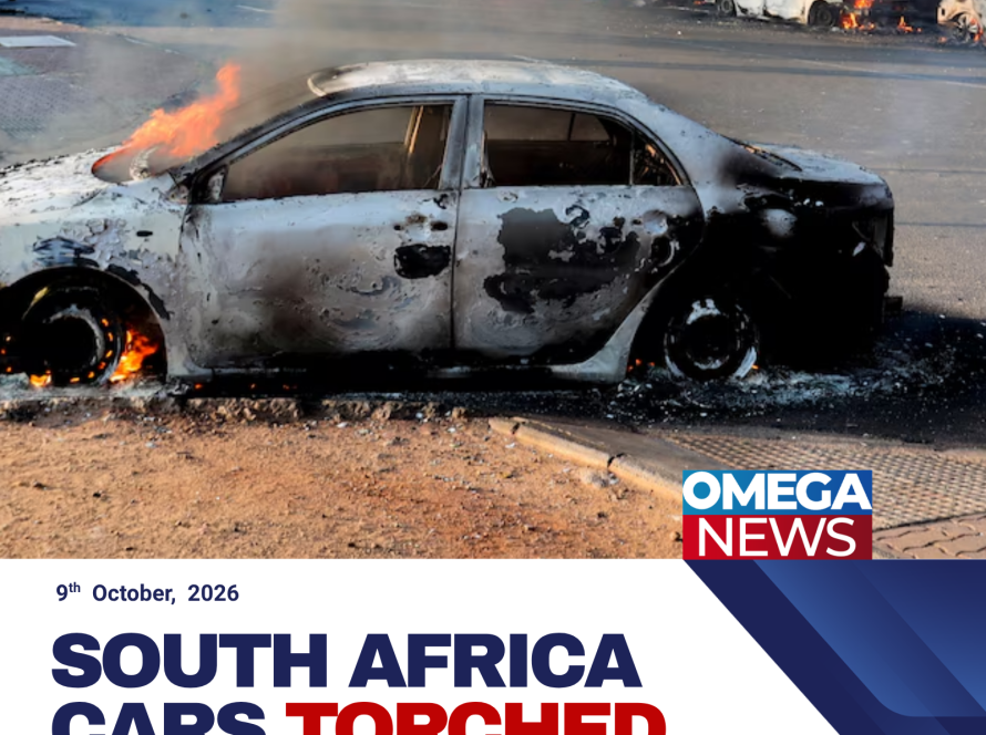 Burned-out vehicles line a street in Soweto, South Africa, following protests against a Constitutional Court ruling on asylum access.